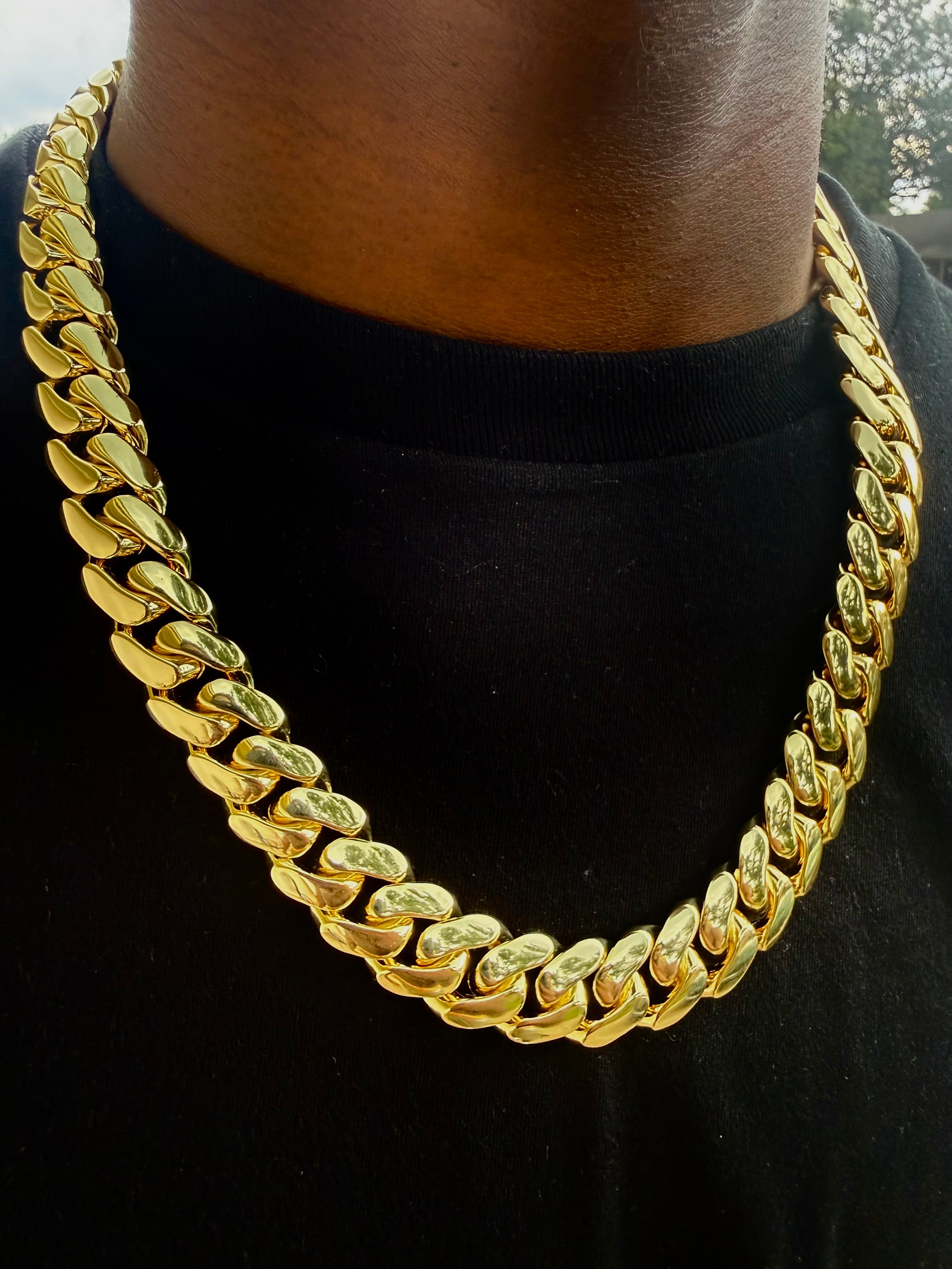 Yellow gold Cuban link chain close-up showing polished link detail