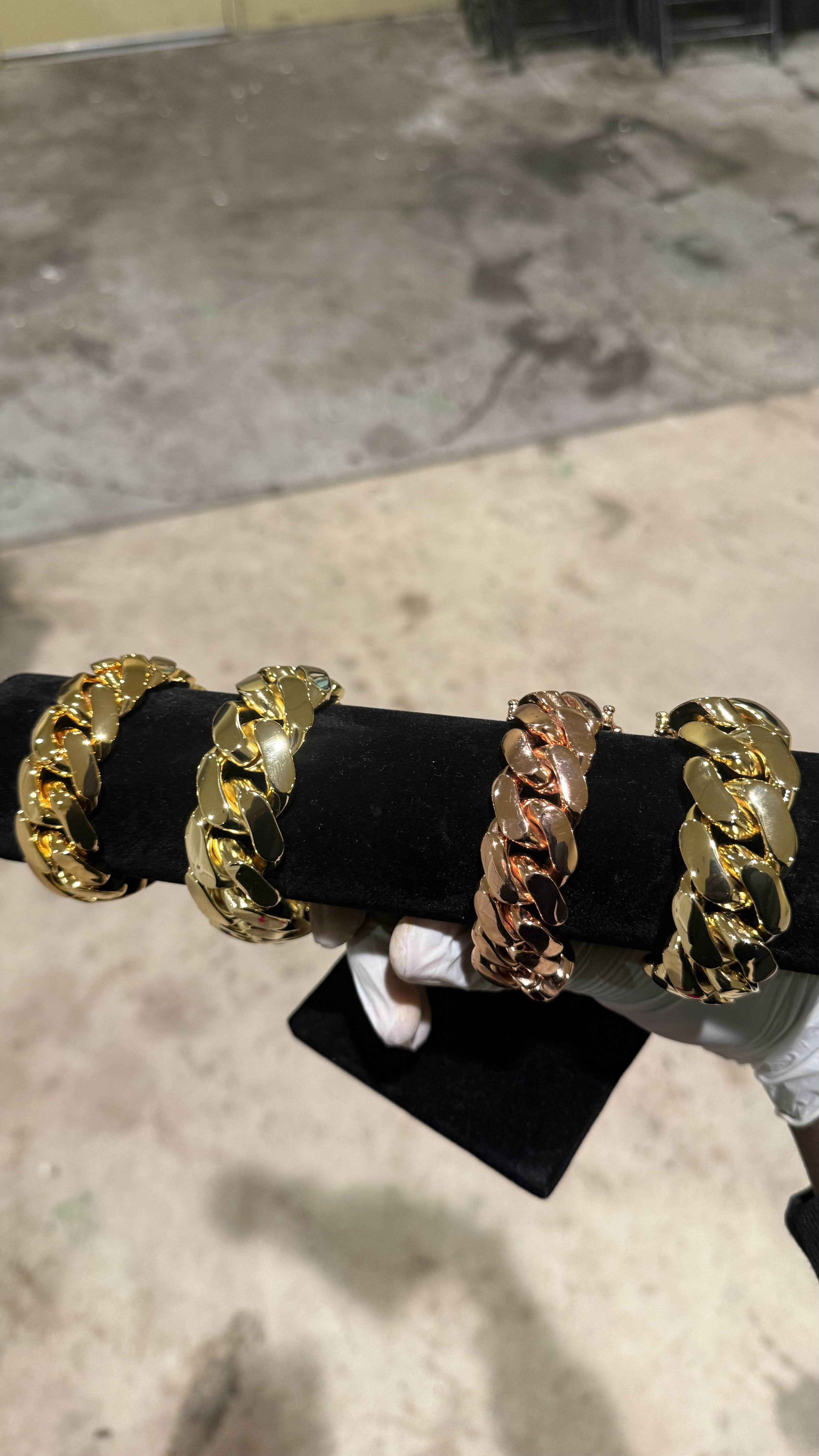 Gold Cuban link bracelet laid flat showing full length