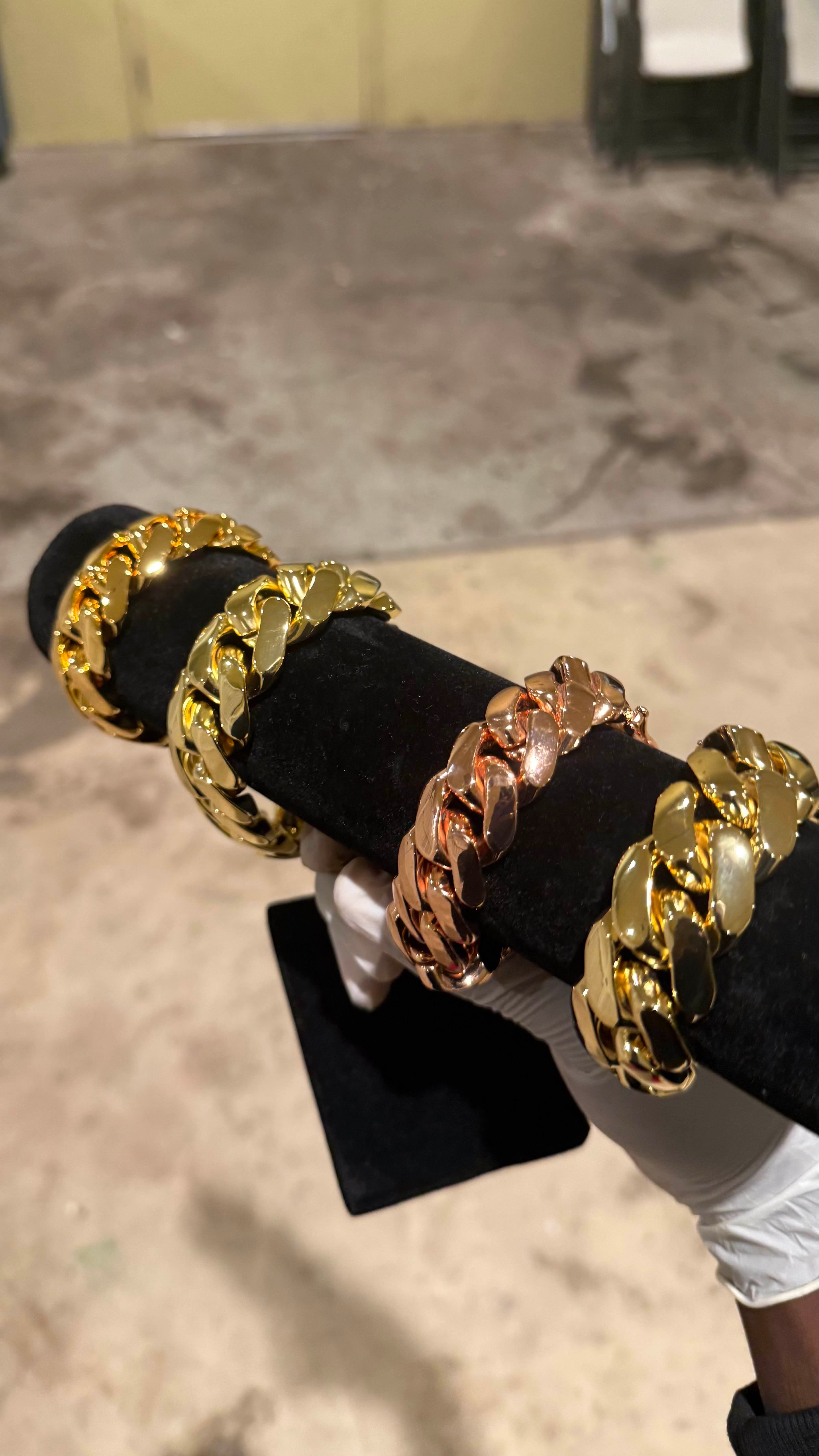 Gold Cuban link bracelet, front view on display